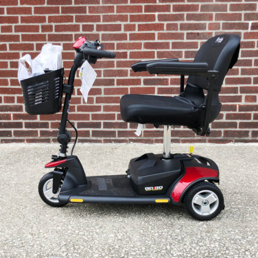 Pride Elite Traveller three wheeled mobility scooter - red - left side view