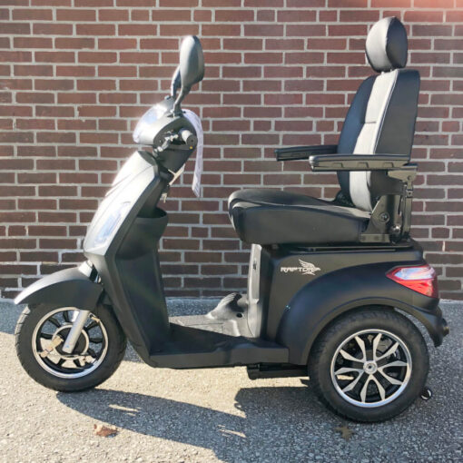 Pride's Raptor. A three-wheeled mobility scooter shown in black - left side view