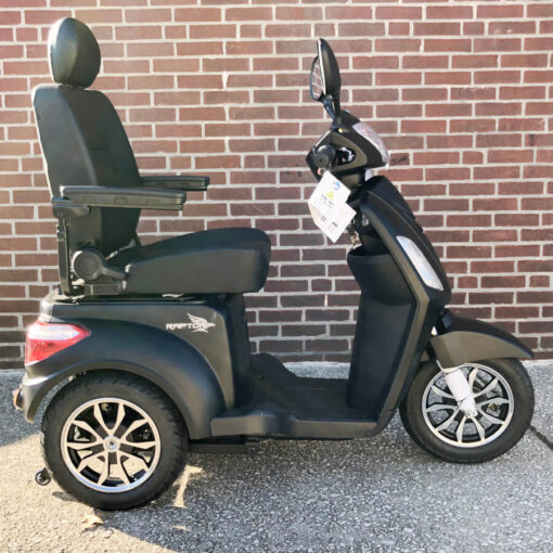 Pride's Raptor. A three-wheeled mobility scooter shown in black - right side view