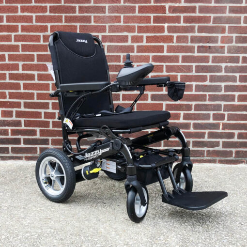 Pride Jazzy Passport electric wheelchair - black - three quarter view