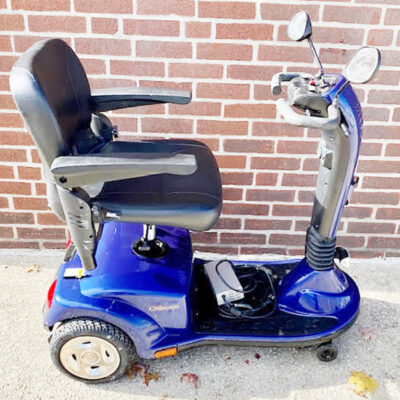 Companion three-wheeled mobility scooter from Golden shown in blue. Right side view